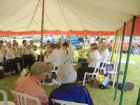 A group of old men discuss a Riley Elf while the band plays on - click for full size image A group of old men discuss a Riley Elf while the band plays on - click for full size image