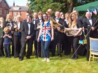 Band, helpers and organiser after the Olympic Torch Relay - click for full size image